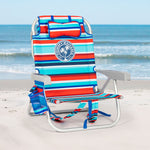 Colorful striped beach chair with a Tommy Bahama logo on a sandy beach.