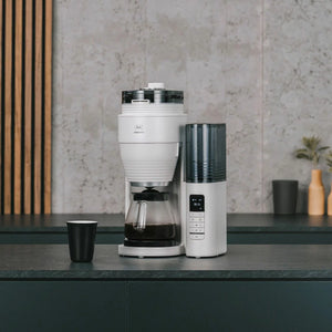 Machine à café Melitta Aromafresh II Grind & Brew Pro X avec filtre en verre et carafe.