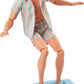 Poupée Ken du film Barbie, vêtue d'un ensemble de plage à rayures roses et vertes pastel assorties.