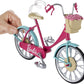 Vélo Barbie avec panier de fleurs