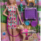Poupée Barbie avec un chiot en peluche et un chien en fauteuil roulant